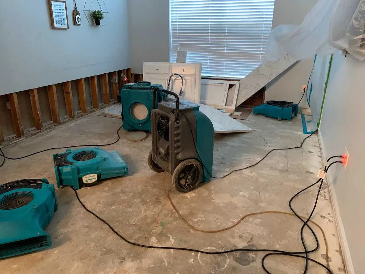 Dehumidifier in flood-cut room for Water Damage Restoration in Woodway